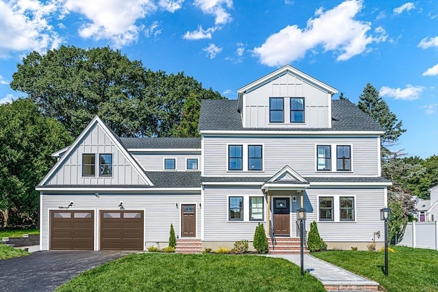 view of front of home featuring a front lawn and a garage