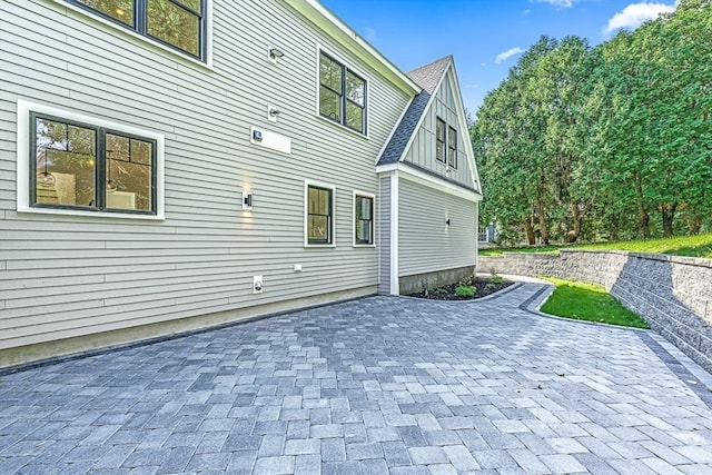 back of property with a patio