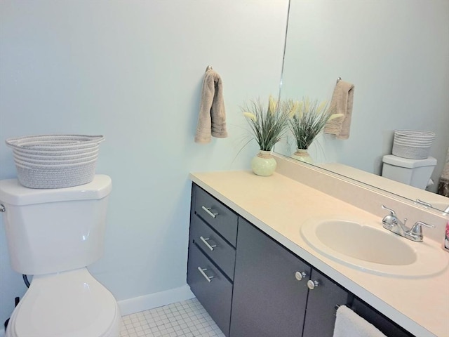 300 Candlewood Park Unit 32, Nashua, NH 03062 - bathroom featuring toilet, vanity, baseboards, and tile patterned floors