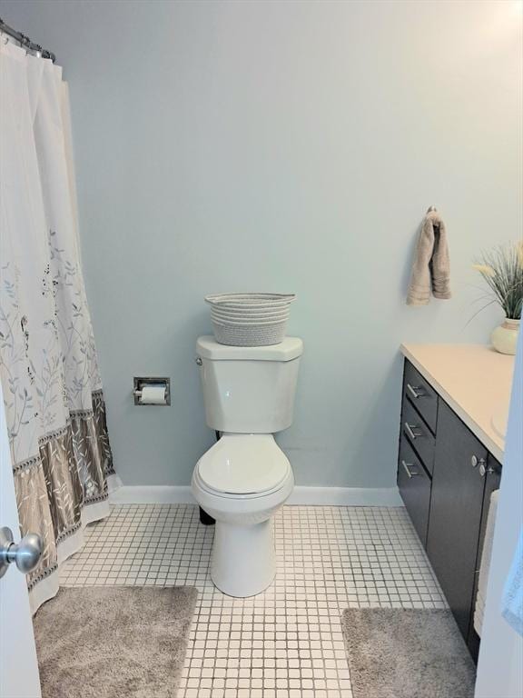 300 Candlewood Park Unit 32, Nashua, NH 03062 - bathroom featuring toilet, baseboards, vanity, and tile patterned flooring