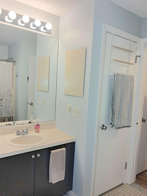 300 Candlewood Park Unit 32, Nashua, NH 03062 - bathroom featuring vanity