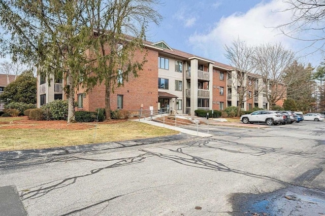 300 Candlewood Park Unit 32, Nashua, NH 03062 - view of apartment building / complex featuring uncovered parking