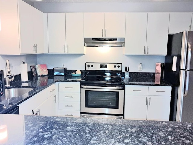 300 Candlewood Park Unit 32, Nashua, NH 03062 - kitchen with under cabinet range hood, stainless steel appliances, white cabinetry, and dark stone counters