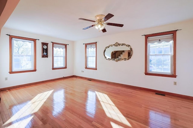 spare room with ceiling fan and light hardwood / wood-style flooring