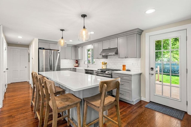 11 Bruce Ln, Wenham, MA 01984 - kitchen with gray cabinets, under cabinet range hood, appliances with stainless steel finishes, plenty of natural light, and recessed lighting