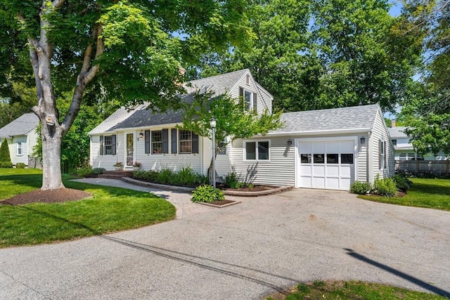 11 Bruce Ln, Wenham, MA 01984 - view of front facade featuring driveway, an attached garage, roof with shingles, and a front lawn