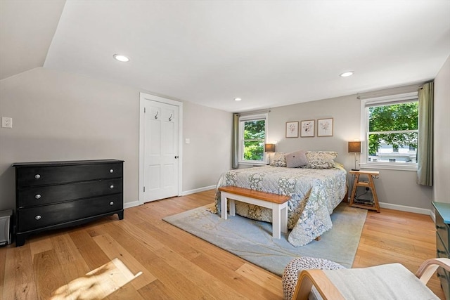 11 Bruce Ln, Wenham, MA 01984 - bedroom with light wood-style flooring, multiple windows, baseboards, vaulted ceiling, and recessed lighting