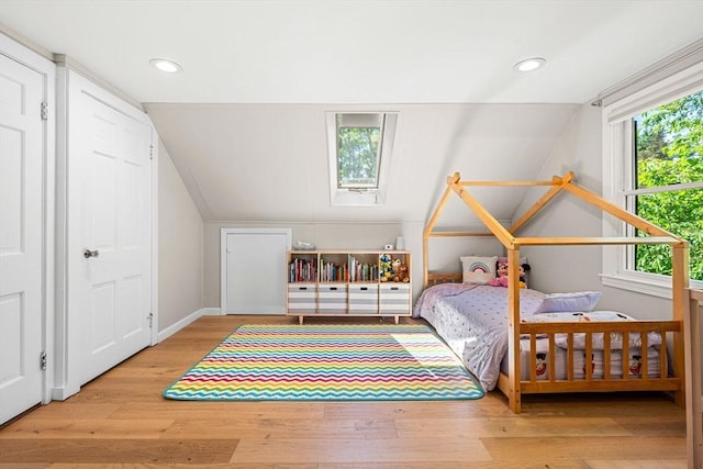 11 Bruce Ln, Wenham, MA 01984 - bedroom featuring lofted ceiling, wood finished floors, baseboards, recessed lighting, and a skylight