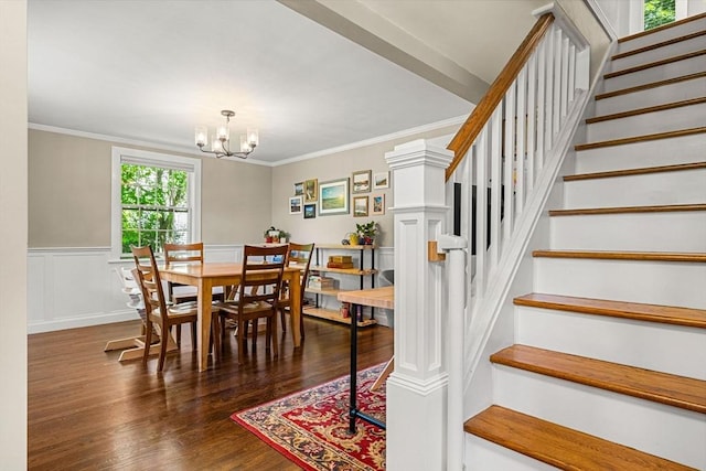 11 Bruce Ln, Wenham, MA 01984 - dining area featuring stairway, a chandelier, wood finished floors, crown molding, and a wainscoted wall