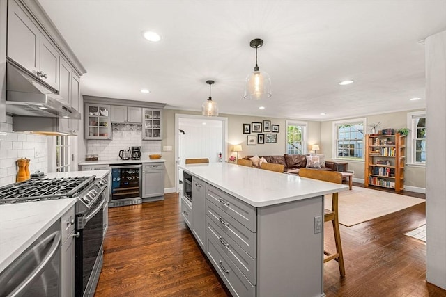 11 Bruce Ln, Wenham, MA 01984 - kitchen featuring gray cabinets, beverage cooler, appliances with stainless steel finishes, open floor plan, and recessed lighting