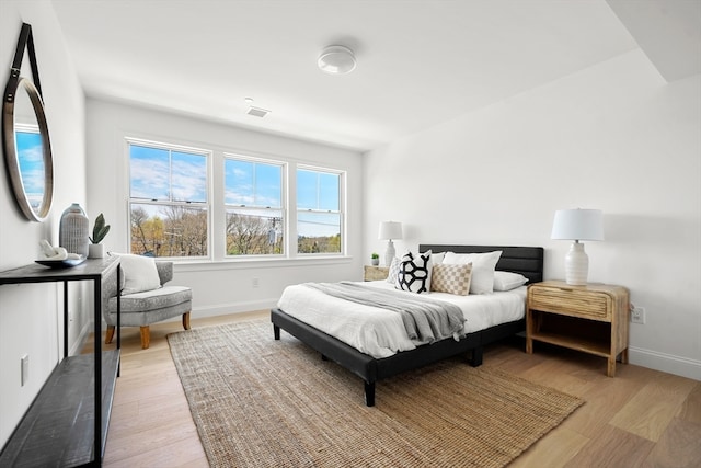 bedroom with light wood-type flooring