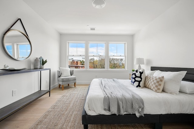 bedroom with light hardwood / wood-style floors