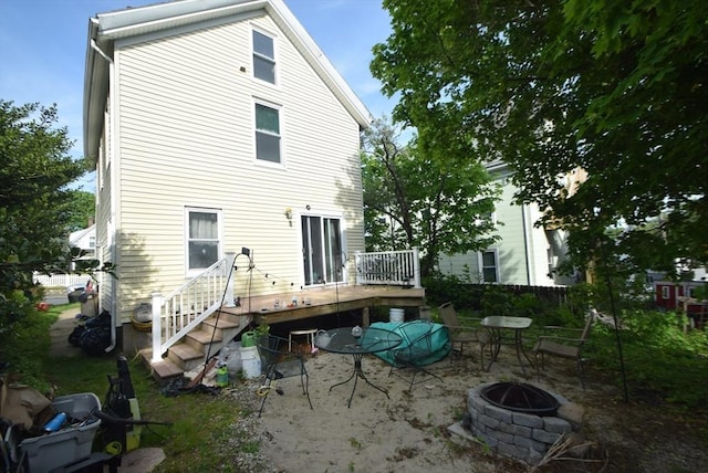 2 Harrison Ave, Gloucester, MA 01930 - back of house featuring an outdoor fire pit, a deck, and a patio