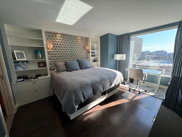 bedroom featuring dark hardwood / wood-style flooring