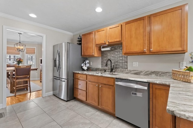 10 Sprucewood Ln Unit 10, Worcester, MA 01606 - kitchen featuring stainless steel appliances, brown cabinets, ornamental molding, a chandelier, and recessed lighting