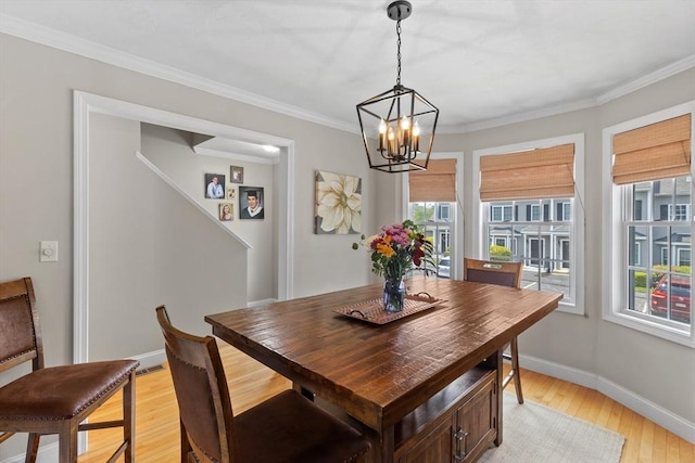 10 Sprucewood Ln Unit 10, Worcester, MA 01606 - dining space with light wood-style flooring, a chandelier, and ornamental molding
