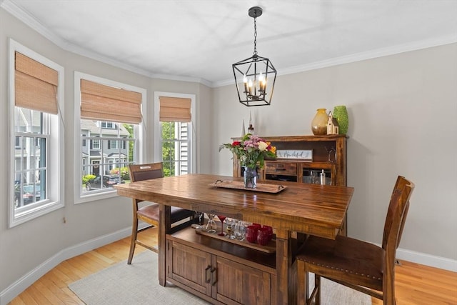 10 Sprucewood Ln Unit 10, Worcester, MA 01606 - dining space featuring plenty of natural light, a chandelier, light wood-type flooring, and crown molding