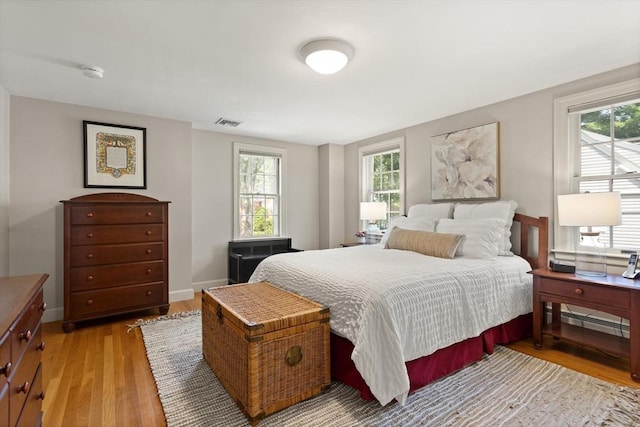 94 Laurel Dr, Needham, MA 02492 - bedroom with multiple windows and light wood-type flooring