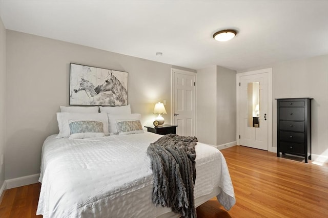 94 Laurel Dr, Needham, MA 02492 - bedroom featuring baseboards and light wood finished floors