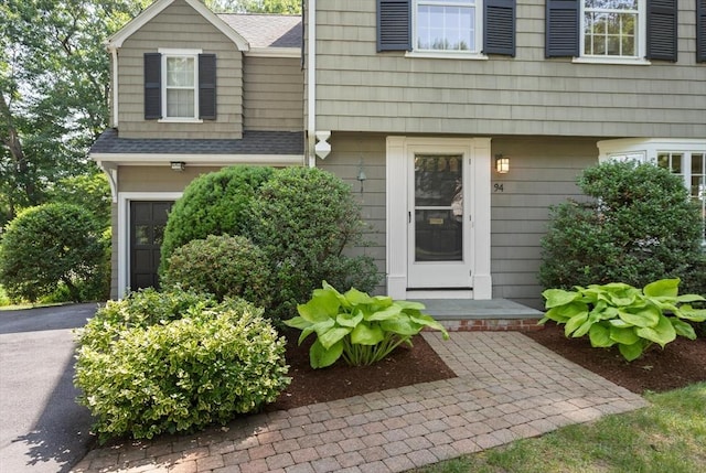 94 Laurel Dr, Needham, MA 02492 - doorway to property featuring roof with shingles