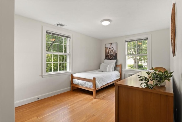 94 Laurel Dr, Needham, MA 02492 - bedroom featuring radiator and light wood finished floors
