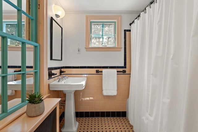 94 Laurel Dr, Needham, MA 02492 - full bath featuring a shower with shower curtain, wainscoting, and tile walls