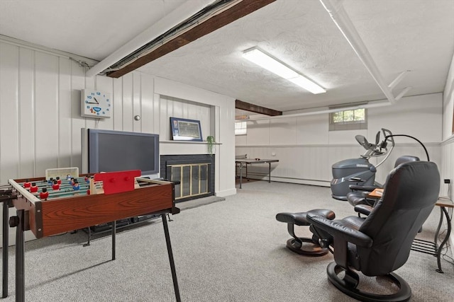 94 Laurel Dr, Needham, MA 02492 - game room featuring a glass covered fireplace, carpet, and a baseboard heating unit