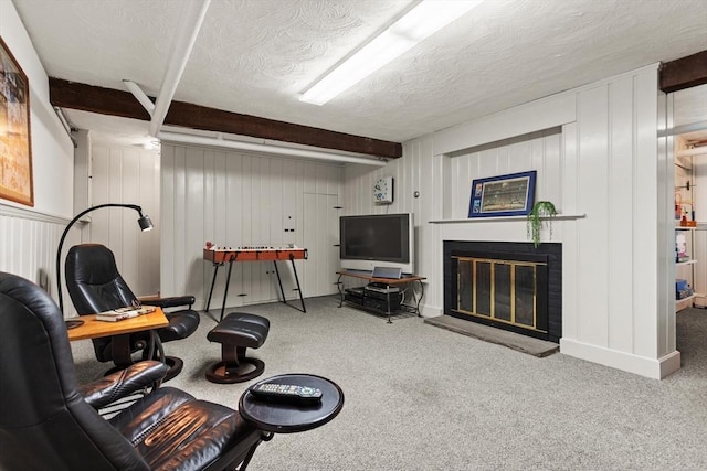 94 Laurel Dr, Needham, MA 02492 - carpeted living room featuring beamed ceiling, a fireplace, a textured ceiling, and a decorative wall