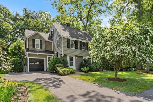 94 Laurel Dr, Needham, MA 02492 - colonial inspired home featuring asphalt driveway, roof with shingles, a garage, a chimney, and a front yard