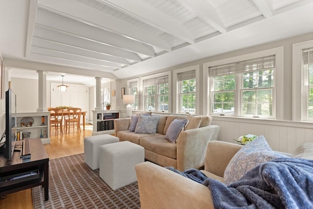 94 Laurel Dr, Needham, MA 02492 - living area featuring decorative columns and dark wood-type flooring