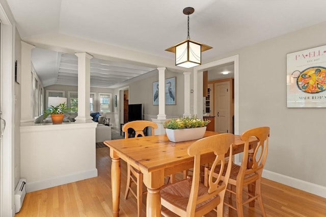 94 Laurel Dr, Needham, MA 02492 - dining area with decorative columns, a baseboard heating unit, and light wood-style flooring