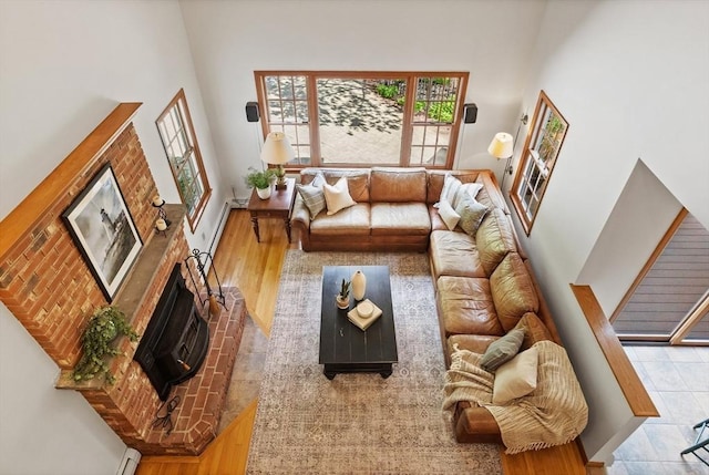 living room featuring a high ceiling and plenty of natural light