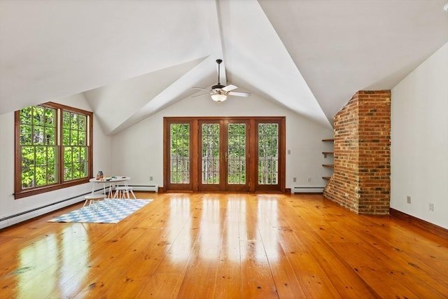 bonus room featuring healthy amount of natural light, hardwood / wood-style floors, a baseboard radiator, ceiling fan, and vaulted ceiling