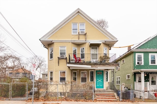 view of front property featuring a balcony