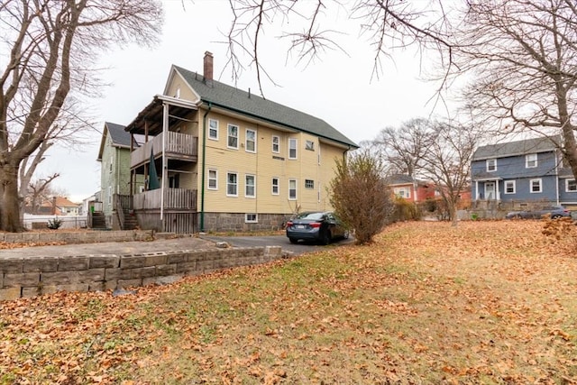 view of property exterior featuring a balcony