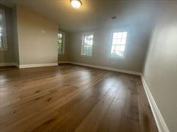 spare room featuring hardwood / wood-style floors