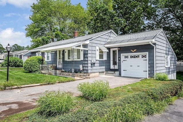 101 Harold Ave, Dracut, MA 01826 - ranch-style house featuring an attached garage, concrete driveway, a front yard, and a chimney