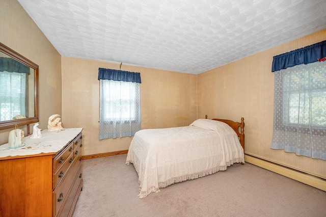 101 Harold Ave, Dracut, MA 01826 - bedroom featuring a baseboard heating unit and light carpet