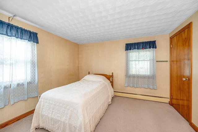 101 Harold Ave, Dracut, MA 01826 - bedroom featuring multiple windows, a baseboard radiator, and carpet flooring