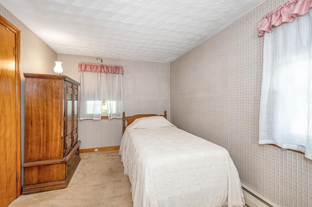 101 Harold Ave, Dracut, MA 01826 - bedroom with a baseboard radiator, light colored carpet, and wallpapered walls