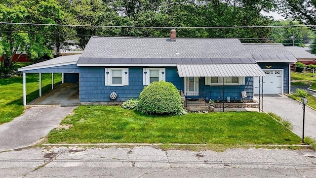 101 Harold Ave, Dracut, MA 01826 - view of front of house with asphalt driveway, a front yard, a standing seam roof, and a metal roof