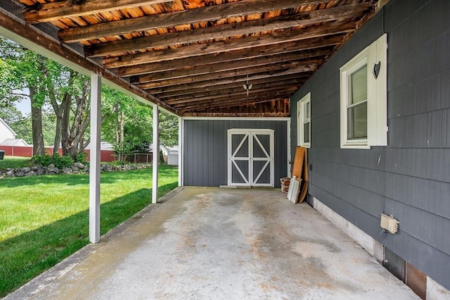 101 Harold Ave, Dracut, MA 01826 - view of patio featuring a carport, an outbuilding, and an exterior structure