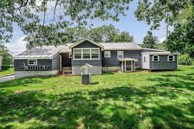101 Harold Ave, Dracut, MA 01826 - back of house featuring a lawn