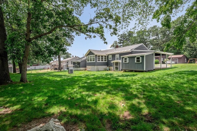 101 Harold Ave, Dracut, MA 01826 - back of property with a chimney