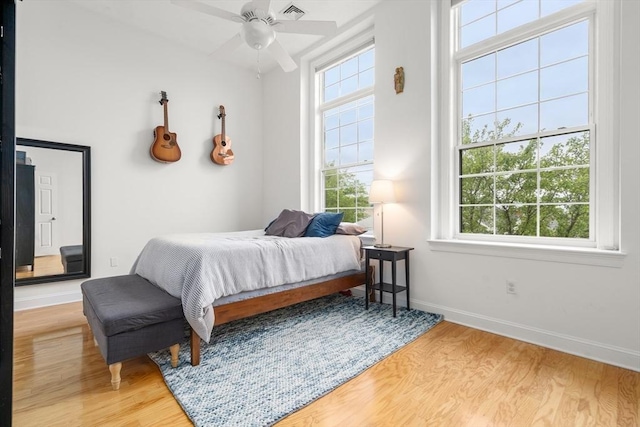 215 Harvard St Unit 40, Medford, MA 02155 - bedroom featuring light wood-style flooring, baseboards, and a ceiling fan
