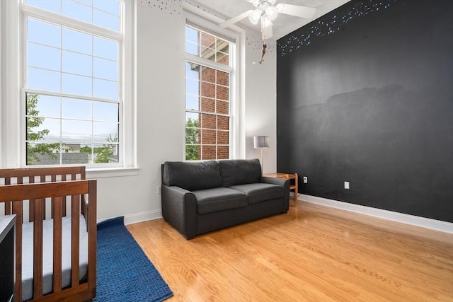 215 Harvard St Unit 40, Medford, MA 02155 - living area featuring wood finished floors, a ceiling fan, and baseboards