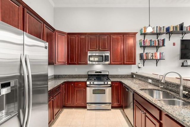 215 Harvard St Unit 40, Medford, MA 02155 - kitchen with appliances with stainless steel finishes, reddish brown cabinets, a sink, crown molding, and dark stone counters