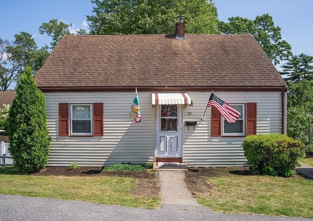89 Audubon Ave, Braintree, MA 02184 - new england style home featuring a shingled roof, a chimney, and a front yard