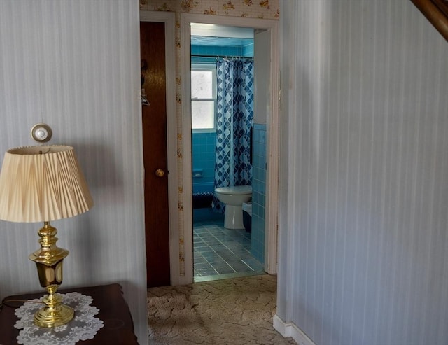 89 Audubon Ave, Braintree, MA 02184 - hallway featuring tile walls, carpet floors, and a wainscoted wall