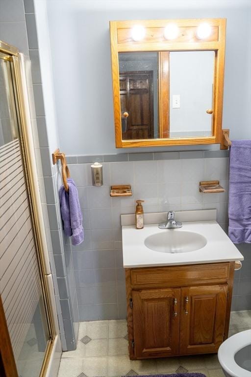 89 Audubon Ave, Braintree, MA 02184 - full bathroom featuring vanity, a stall shower, tile walls, and tile patterned flooring